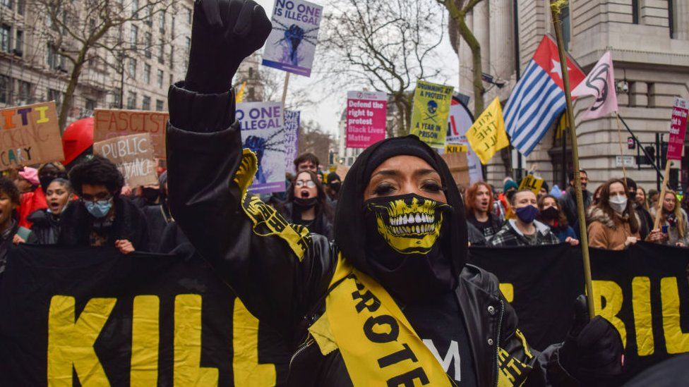 A demonstrator holds up a fist during the Kill The Bill protest.