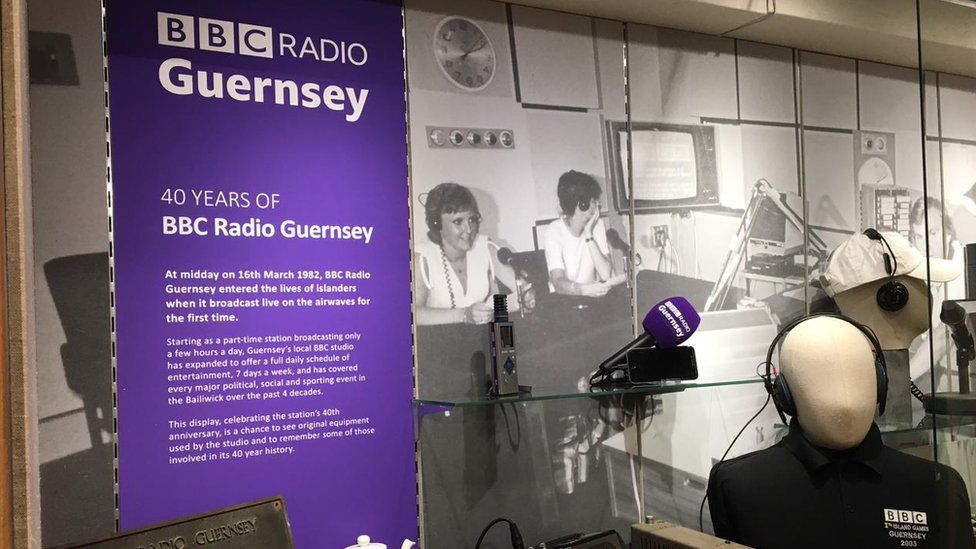 Items in a display case for 40th anniversary of BBC Radio Guernsey