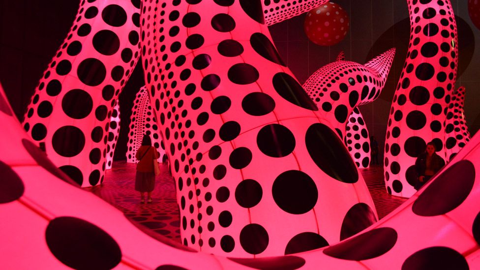 Yayoi Kusama inflatable polka . sculptures at Aviva Studios in Manchester