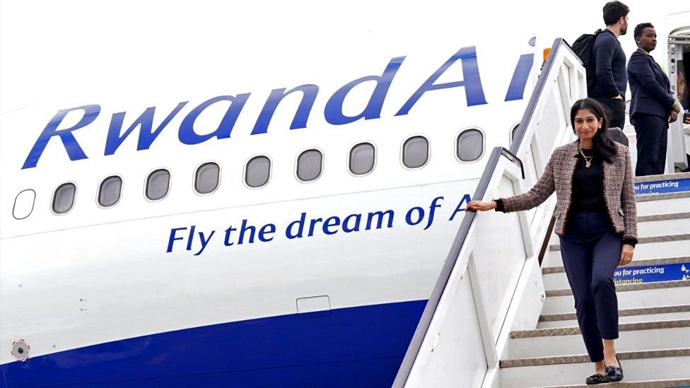 Home Secretary Suella Braverman disembarks her plane as she arrives at Kigali International Airport for her visit to Rwanda on 18 March 2023
