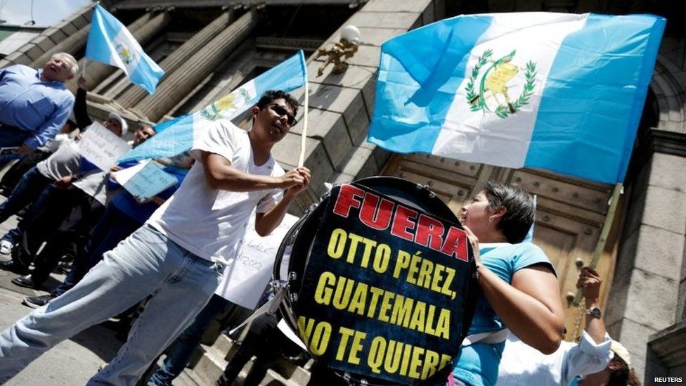 Demonstrators yell slogans as they stand outside the Congress in Guatemala City on 1 September, 2015.