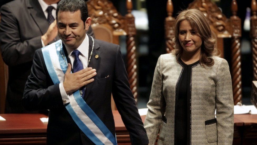 Jimmy Morales, accompanied by his wife Gilda Marroquin, acknowledges after being sworn-in as president in Guatemala City, January 14, 2016.