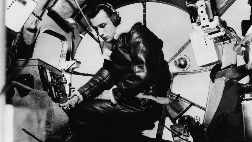 Bombardier, Lieutenant Harry Erickson of the 97th Bomb Group, in the nose of a B-17 Flying Fortress, July 1942