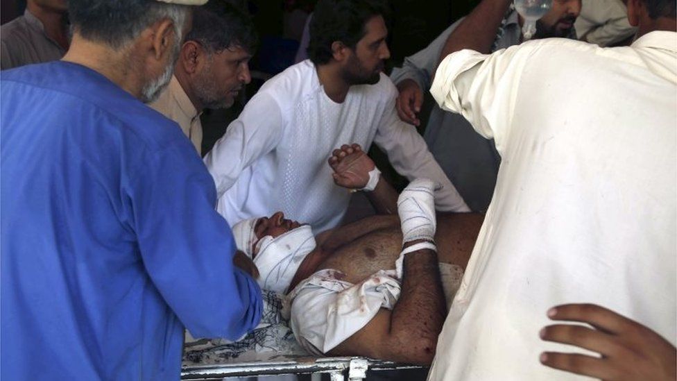 A man who was injured in a twin suicide bomb blasts, that targeted girl's schools, receive medical attention at a hospital in Jalalabad, Afghanistan, 11 September 2018.
