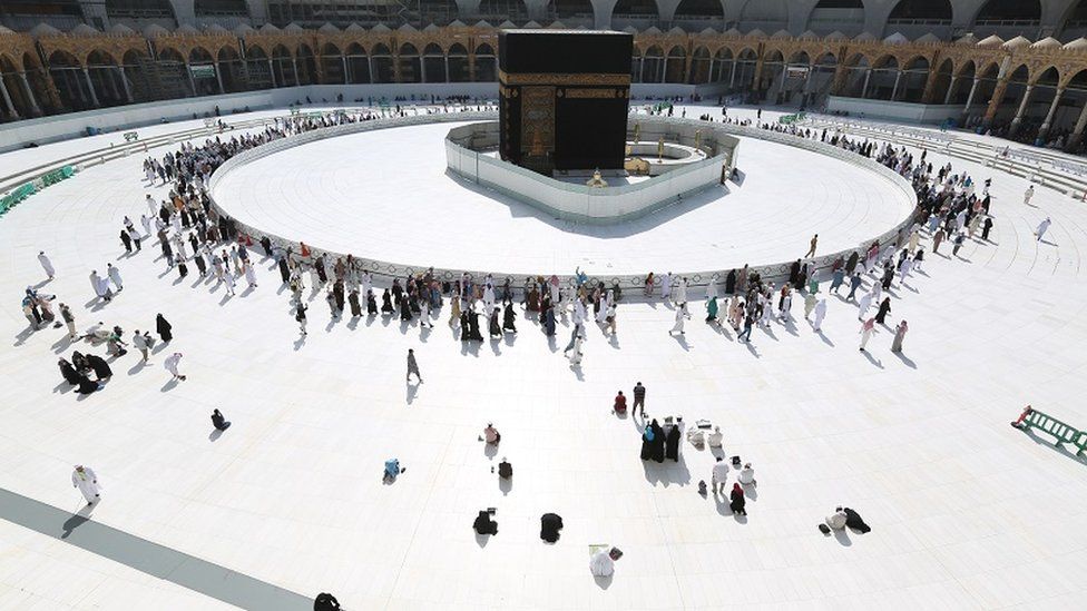Vastly reduced visitor numbers circle the sacred Kaaba at Mecca's Grand Mosque