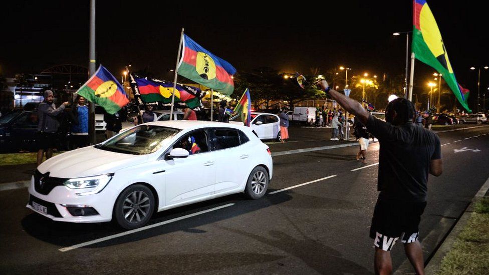 Kanak independence supporters wave flags of the Socialist Kanak National Liberation Front (FLNKS) after the referendum on independence in Nouméa on 4 October 2020