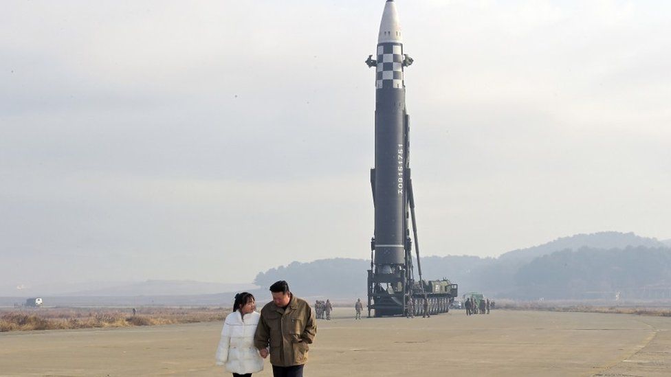 Him Jong-Un with his daughter at a missile test