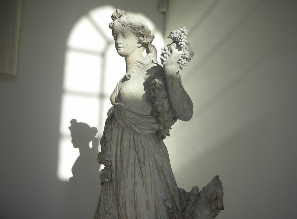 A sculpture with window light falling over it
