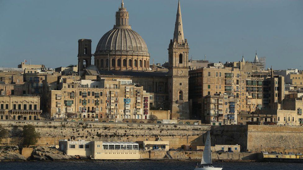 Valletta, including the dome of the Basilica of Our Lady of Mount Carmel, stands on March 29, 2017 as seen from opposite the bay in Sliema, Malta