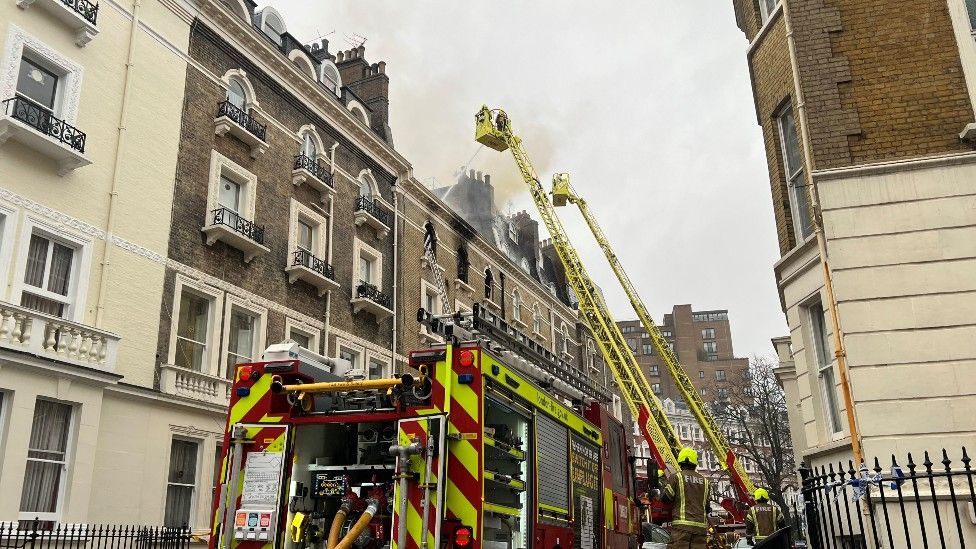 Firefighters remain at the scene of the fire in South Kensington