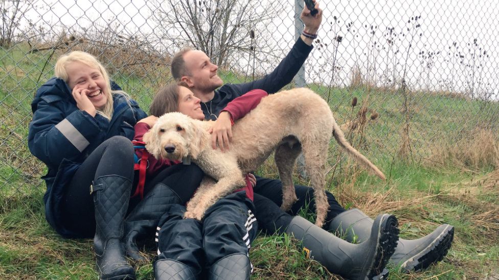 Cooper is reunited with his owner Terri Pittman (centre)