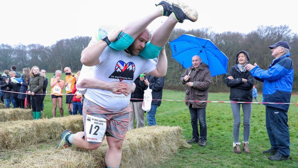 Competitors take part in the annual UK Wife Carrying Race