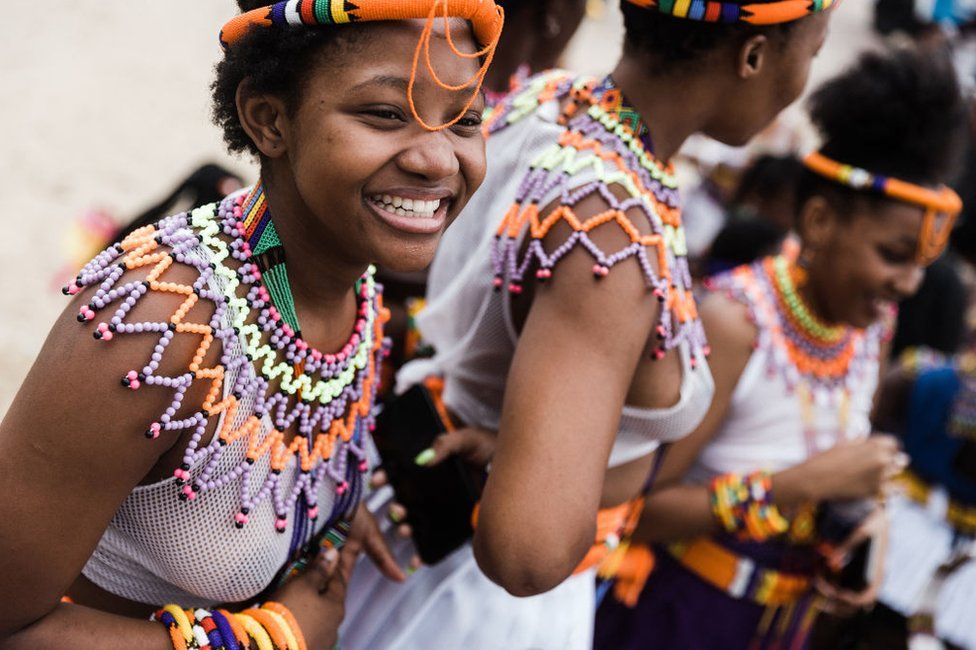Women clad in their traditional Zulu outfits take part during the Indoni SA Cultural Festival on December 18, 2021 in Durban. - The Indoni festival, a three-day feast, showcases traditions of South African provinces and aims to demonstrate unity and the unique diversity of the country.