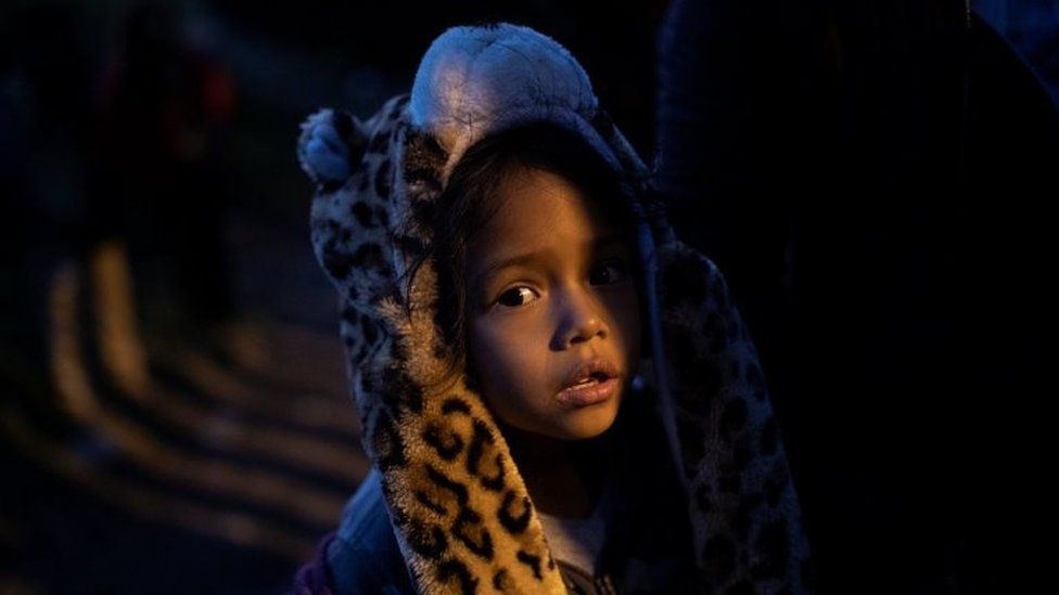 A migrant girl is seen before crossing from Mexico to the U.S with other migrants, in Tijuana, Mexico, December 3, 2018