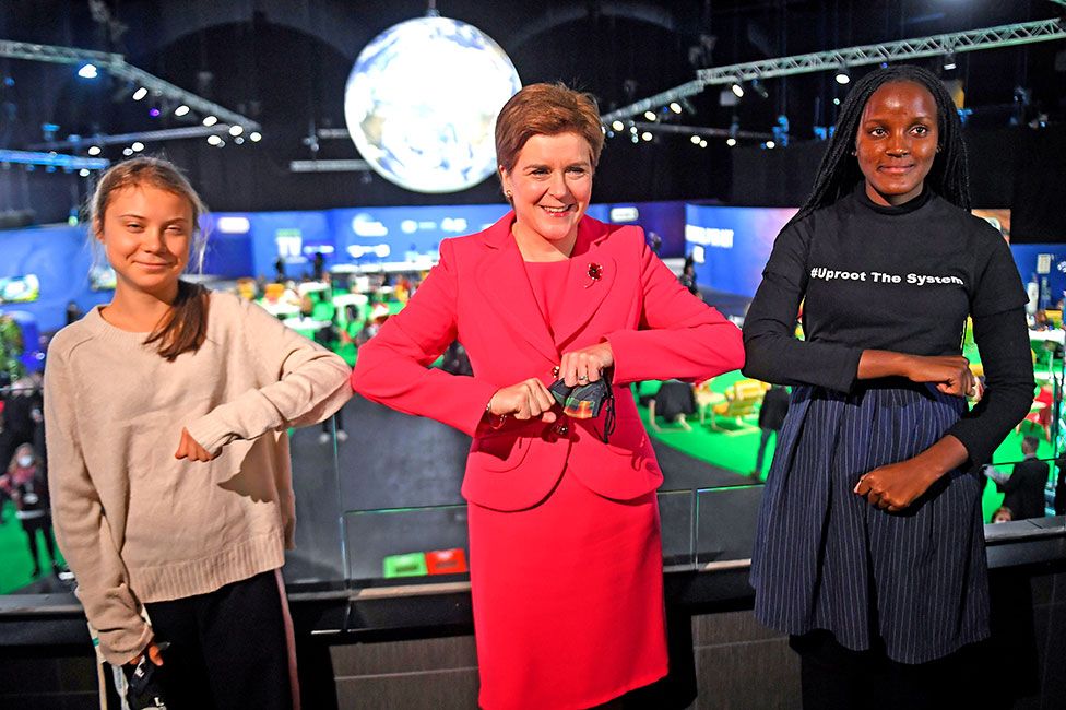 Scotland's First Minister Nicola Sturgeon (centre) with climate activists Vanessa Nakate (right) and Greta Thunberg (left) at the UN Climate Change Conference (COP26) in Glasgow, Scotland, on 1 November 2021