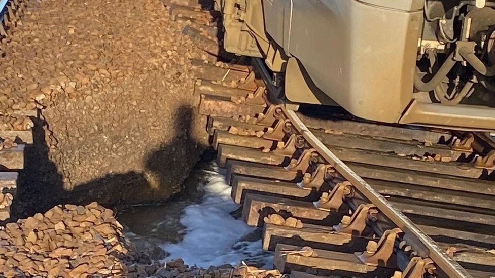 Train on track affected by flooding