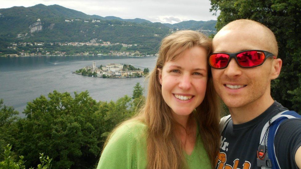 Dan and Esther take a selfie next to a lake