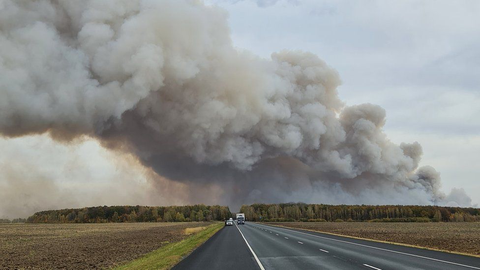 Smoke rises from the site of a fire at an ammunition depot in the Ryazan region of Russia, 7 October 2020