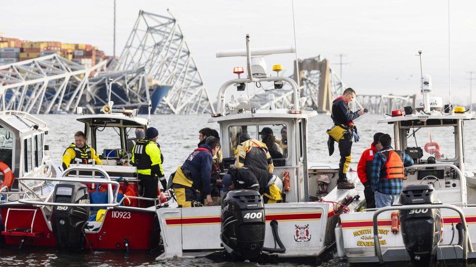 Rescuers prepare to take boats out to the site of the boat crash