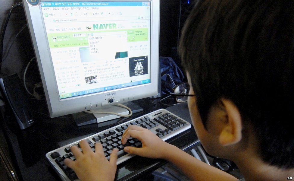 A South Korean student on a computer