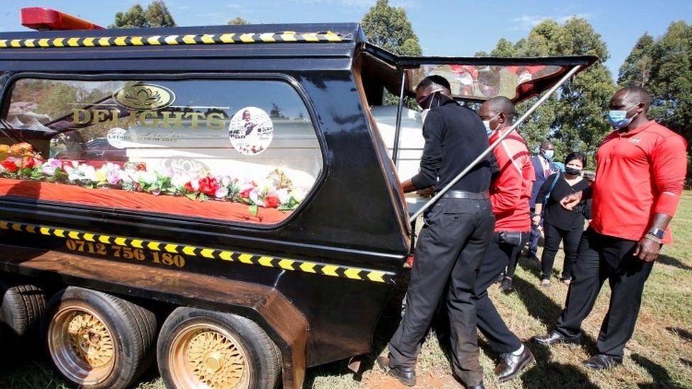 Kenyan athletes prepare to carry the coffin of cross-country skier Agnes Tirop