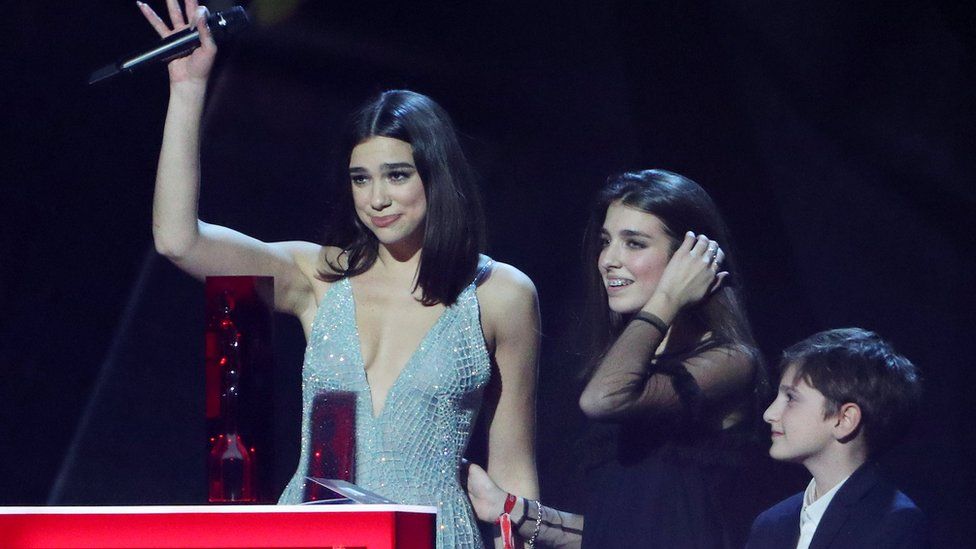 Dua Lipa with her younger sister and brother