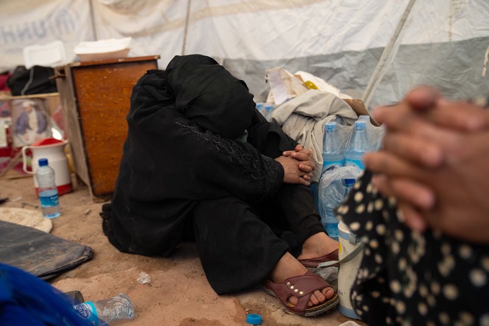 Afghan woman under shelter at Siah Ab