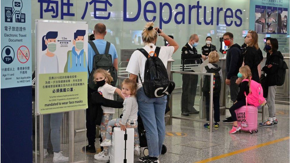 Expat families depart Hong Kong airport as travel restrictions hit hard on Hong Kong's white collar "expat" foreign workers