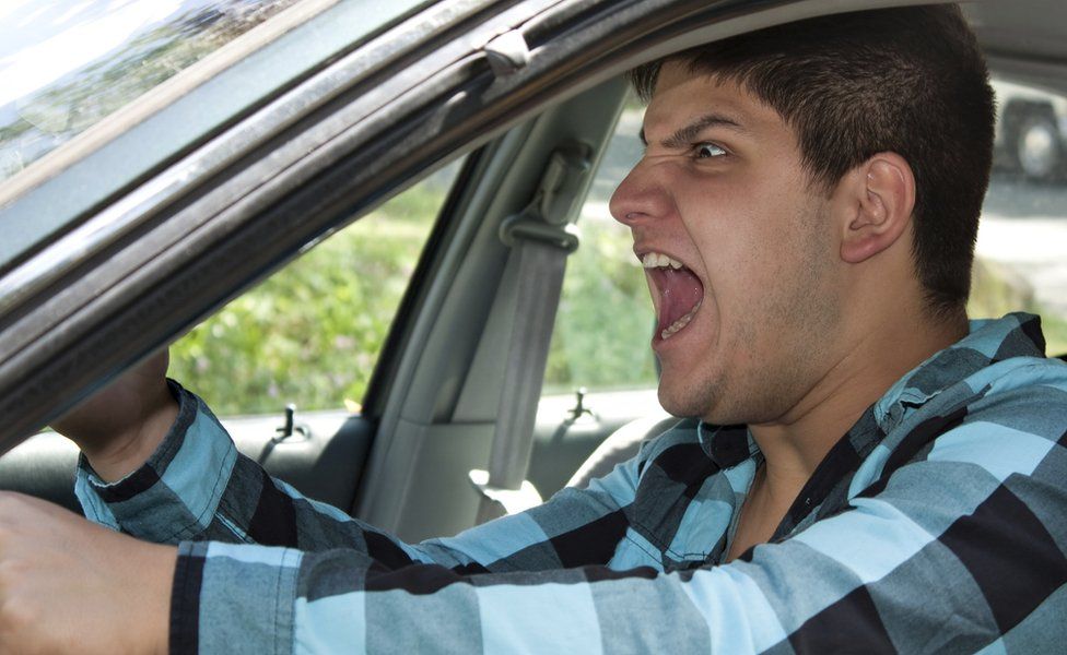 Man shouting in car