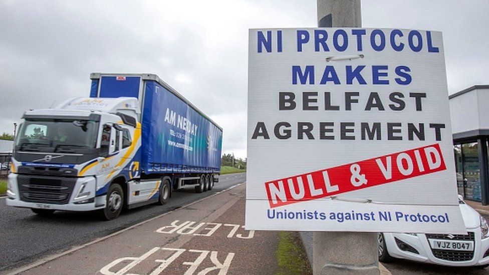 A lorry passes an anti-Northern Ireland protocol sign