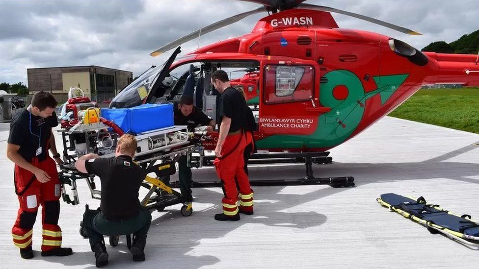 Wales Air Ambulance crew and helicopter
