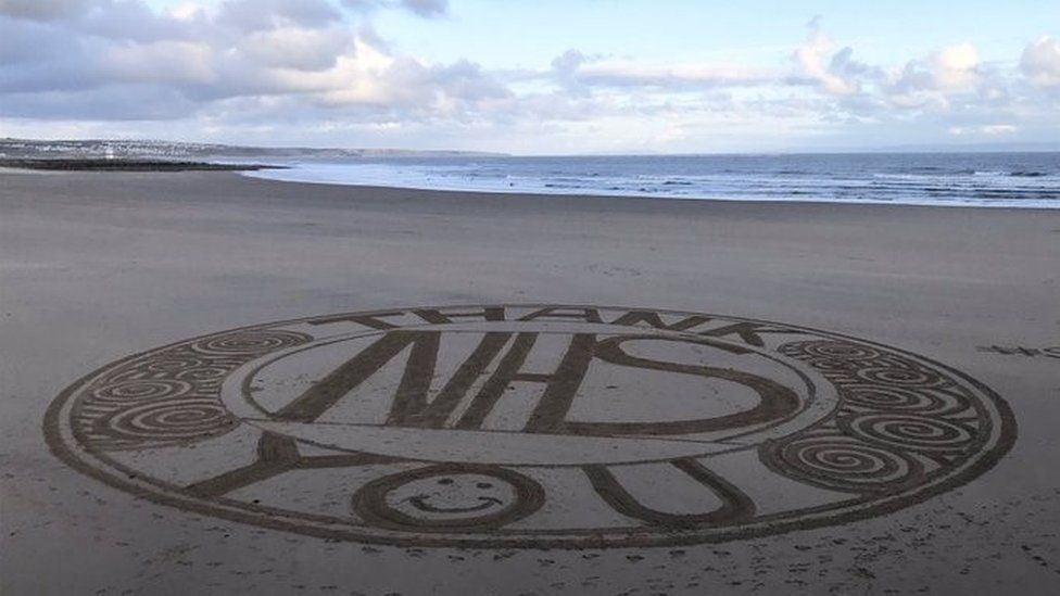 Sand art in Sandy Bay in Porthcawl