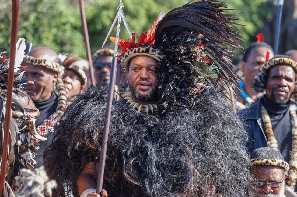 King of Amazulu nation Misuzulu kaZwelithini (C) holds a spear as he sings with Amabutho (Zulu regiments) during his coronation at the KwaKhangelamankengane Royal Palace.