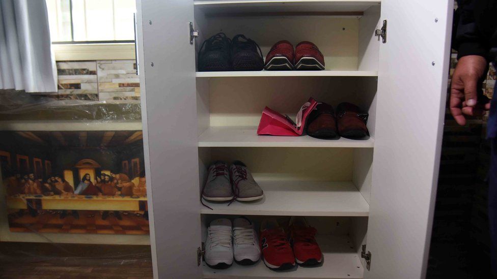 View of shoes at Brazilian drug trafficker Jarvis Chimenes Pavao"s cell at Tacumbu prison in Asuncion on July 28, 2016.