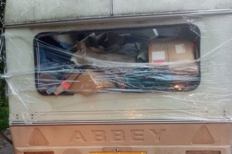 Cling filmwrapped junk caravan dumped in Leeds BBC News