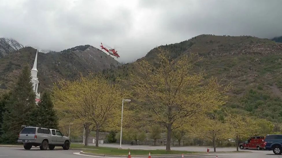 A rescue helicopter heads to Lone Peak in Utah