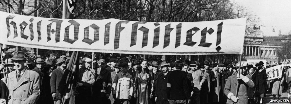 Viennese Nazis celebrate Hitler's arrival in Austria with a banner reading 'Heil Adolf Hitler!' in March 1938