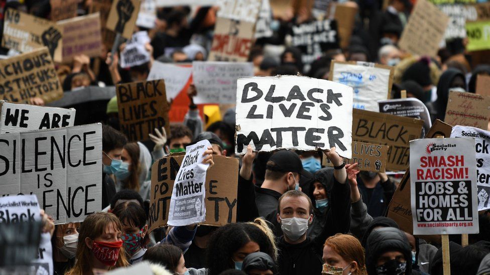 Picture of banners saying 'Black Lives Matter' and 'Silence is Violence' from the protests last year