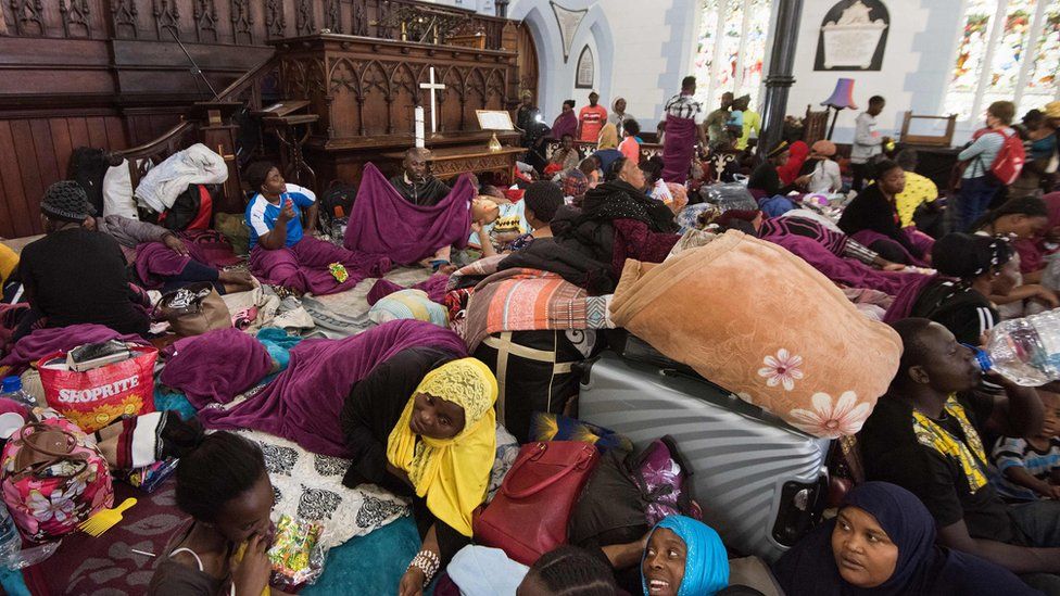 People lying down in Cape Town church