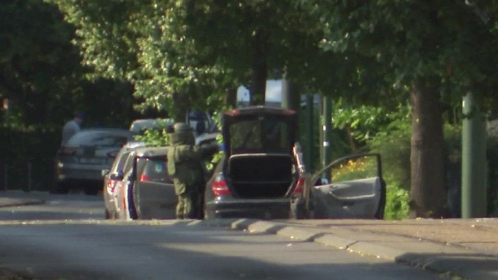 A Belgian bomb squad check the vehicle in which two suspects were found with explosives
