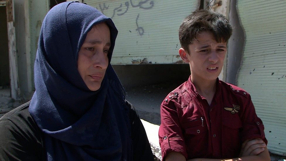 Ishar, a mother-of-four whose husband was killed by IS during the battle for Mosul, and her son