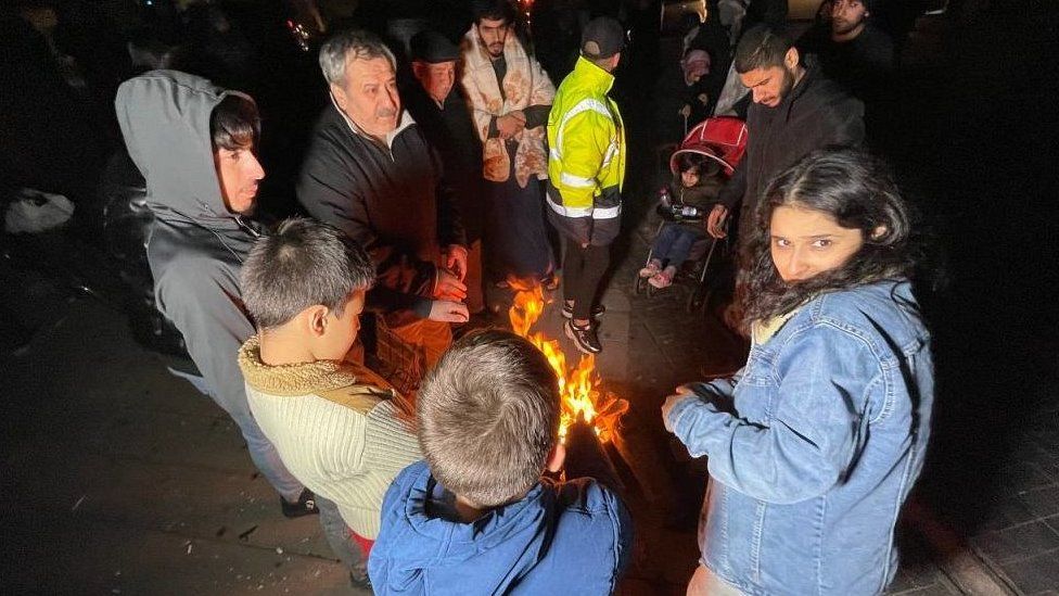 Duzce residents huddled round fire, 23 Nov 22