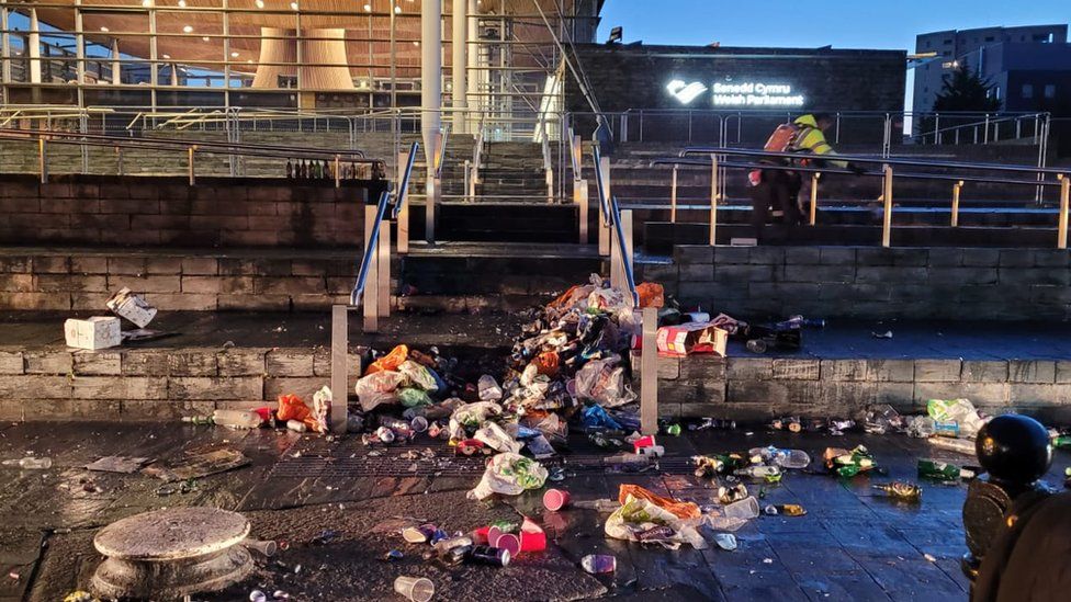 Litter piled up on the steps of the Senedd at Cardiff Bay