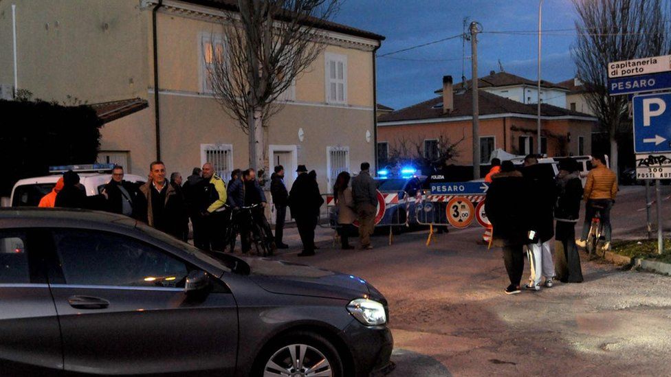 Police secure the area where a World War II explosive device was found in Fano