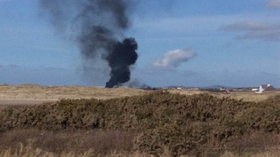 a plume of smoke seen coming from the RAF Valley airfield