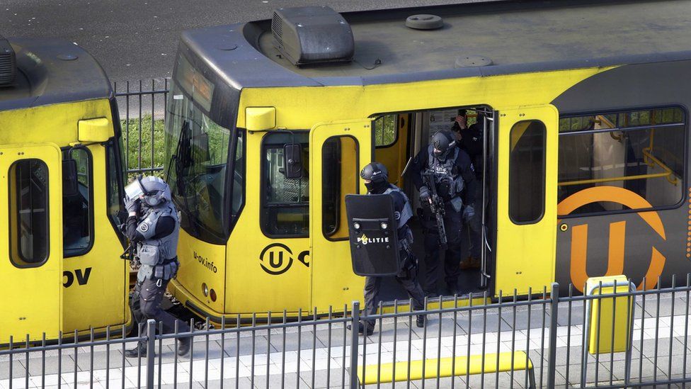 Special Police Forces inspect a tram, after the attack on a tram on Oktoberplein in Utrecht, The Netherlands