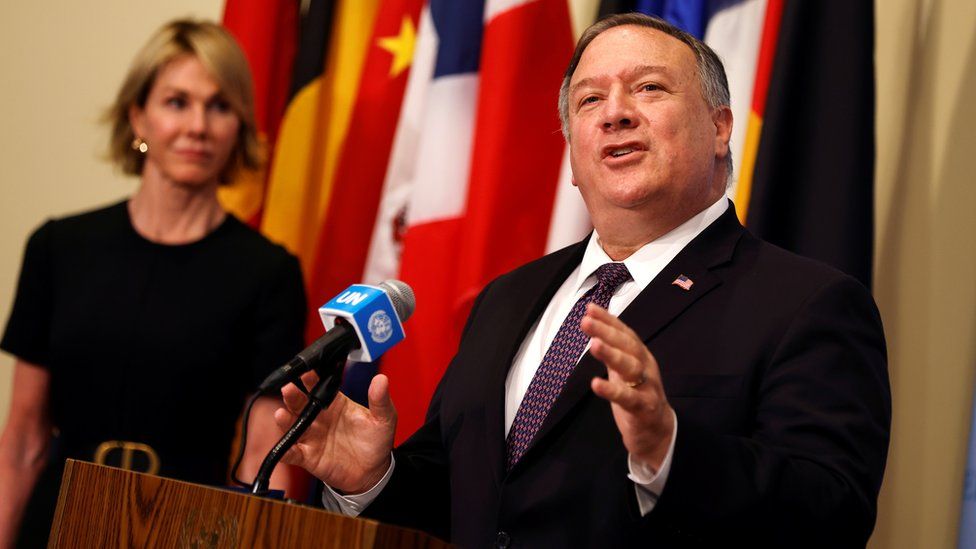 US ambassador Kelly Craft (L) watches Secretary of State Mike Pompeo (R) speak at the UN in New York (20 August 2020)