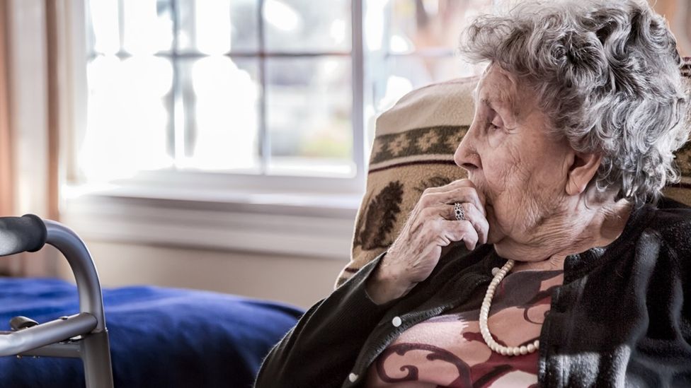 Woman sitting in a care home