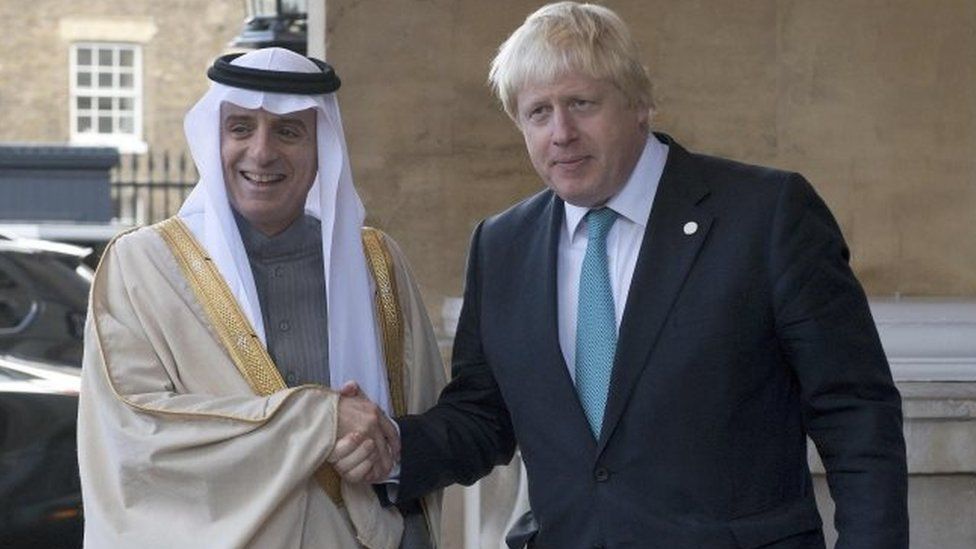 Saudi Arabia's Foreign Minister Adel al-Jubeir is greeted by Boris Johnson