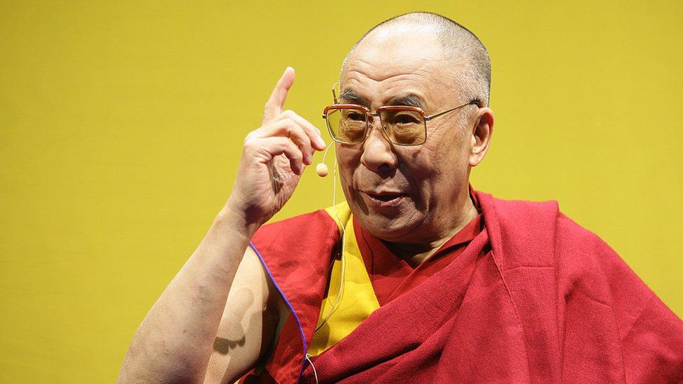 Tibetan spiritual leader his Holiness The Dalai Lama gestures on his arrival at JAKO Arena on May 18, 2008 in Bamberg, Germany.
